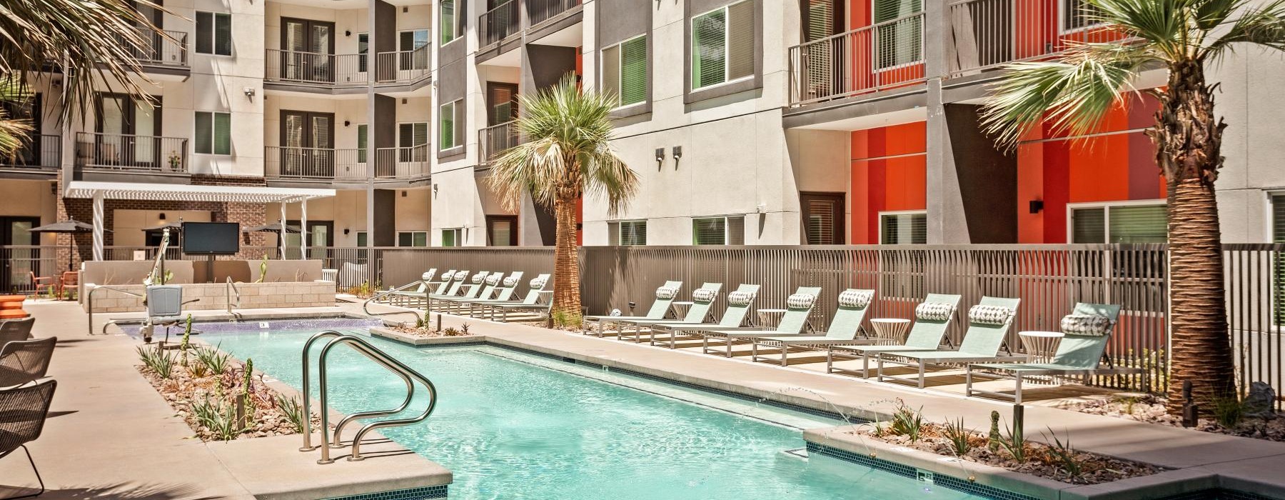 outdoor pool with lounge chairs