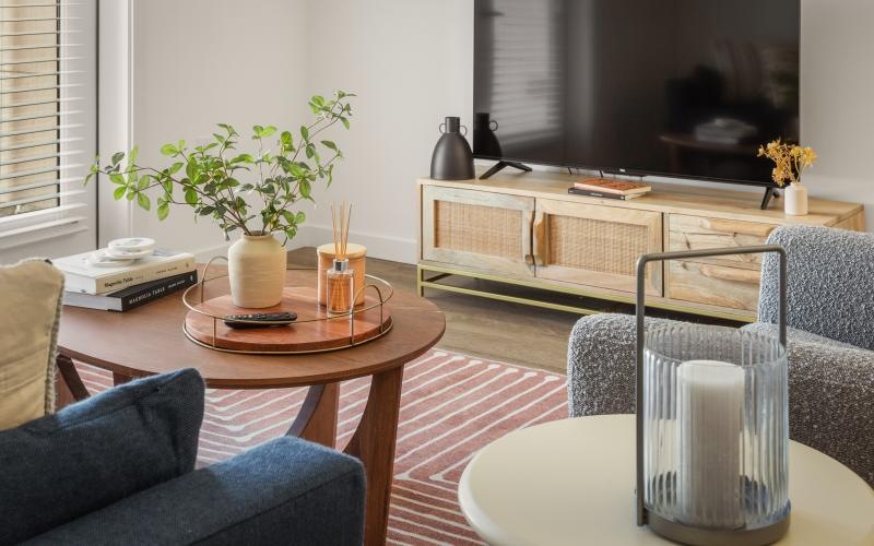 a living room with a table and chairs